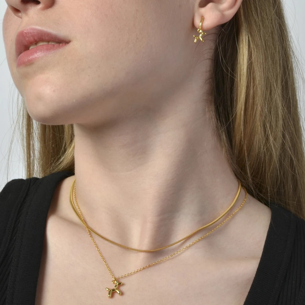 Collar en plata rodiada y plata bañada en oro.